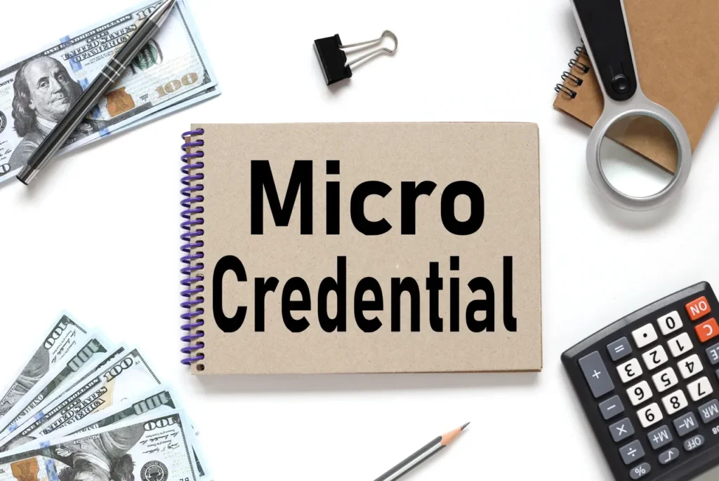 A notebook with 'Micro Credential' written on the cover.