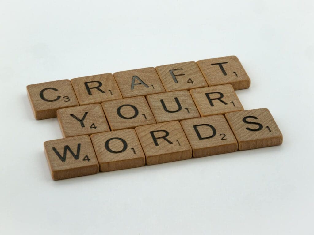 Wooden Scrabble tiles reading "Craft your words"
