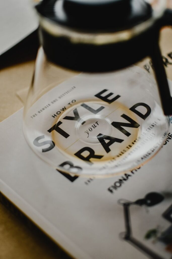 Glass carafe on "Style Your Brand" book