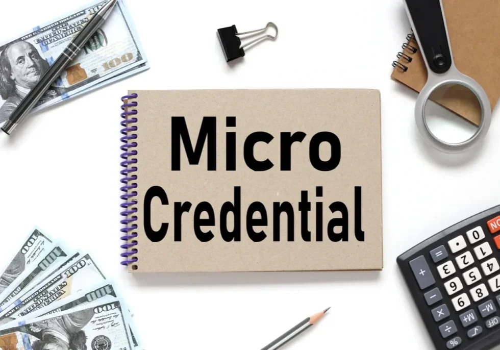 A notebook with 'Micro Credential' written on the cover.