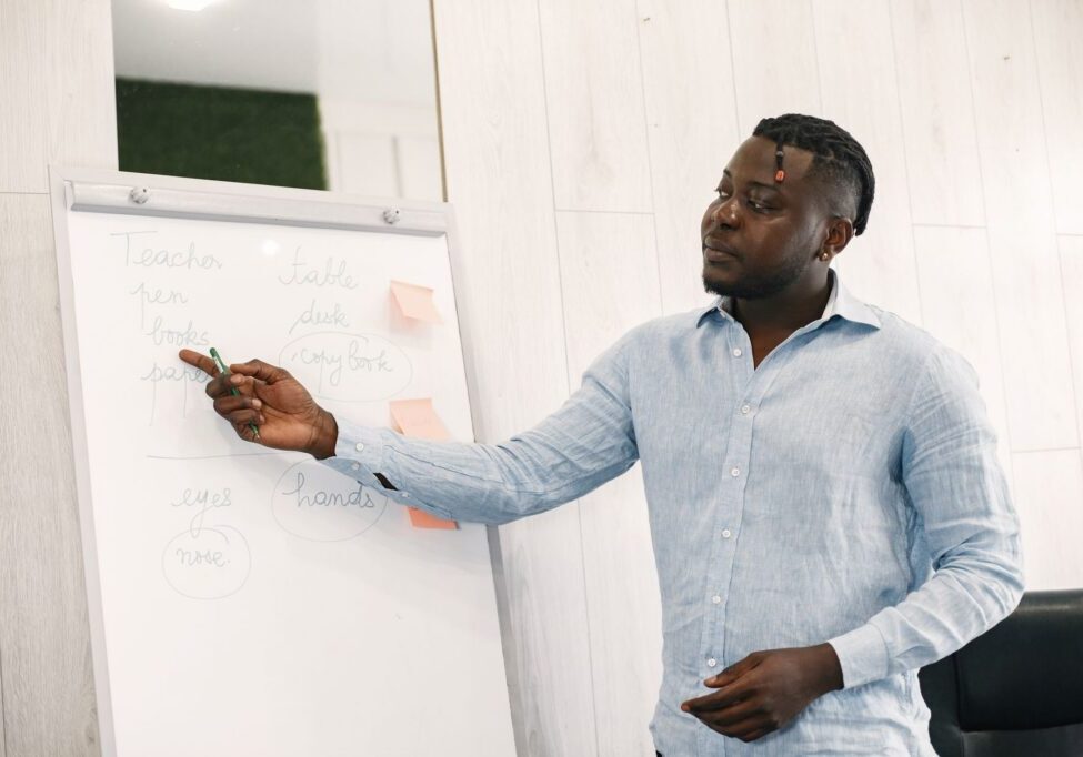 Person pointing at whiteboard